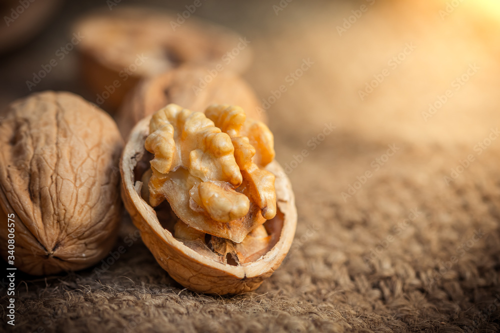 Fototapeta premium still life with Walnut kernels and whole walnuts