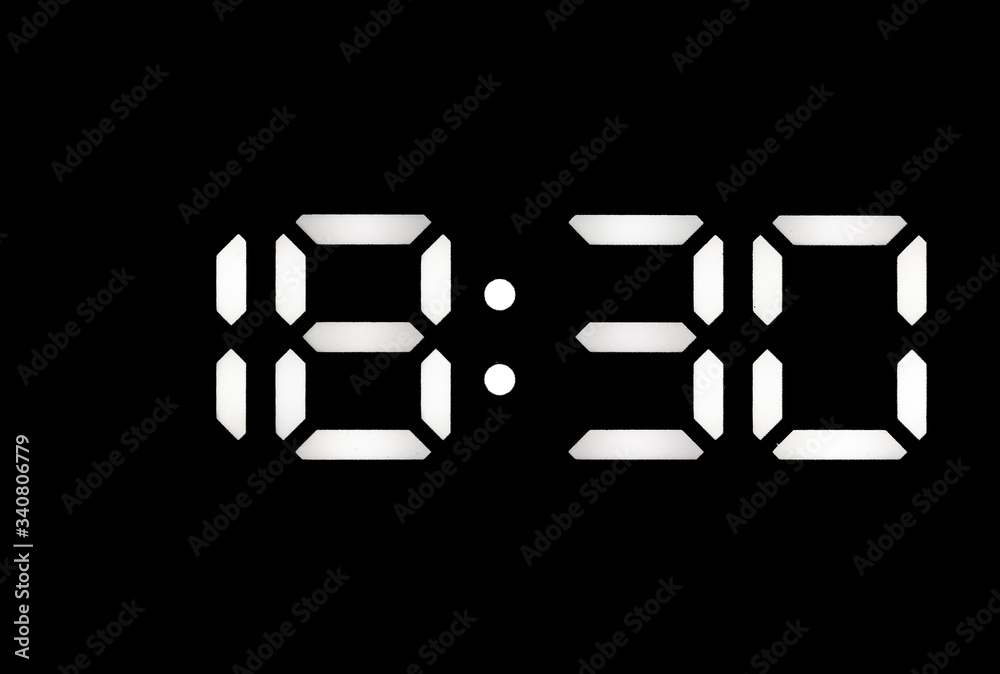 Real white led digital clock on black background Real white led digital clock on black background