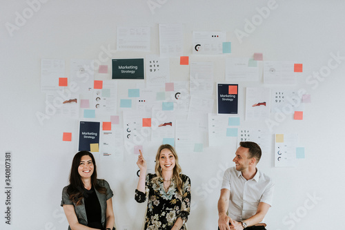 Team pointing at a plan