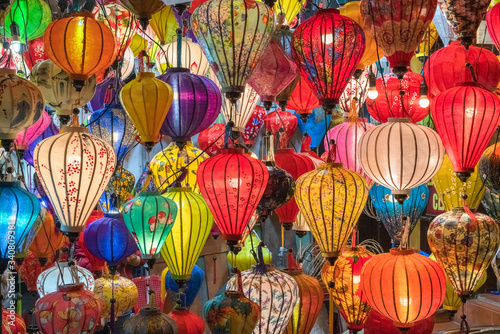 Colorful lanterns spread light on the old street of Hoi An Ancient Town - UNESCO World Heritage Site. Vietnam.