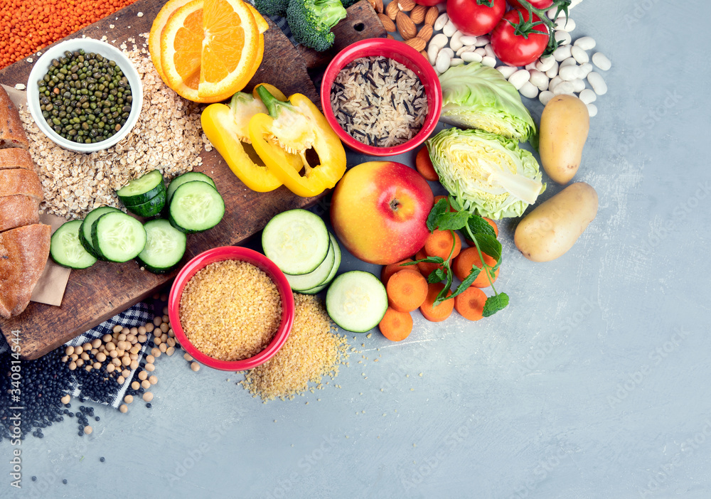 Foods high in carbohydrates on grey background Foods high in carbohydrates on grey background