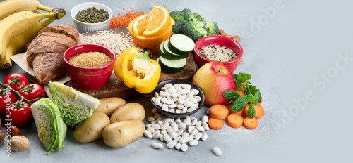 Foods high in carbohydrates on grey background