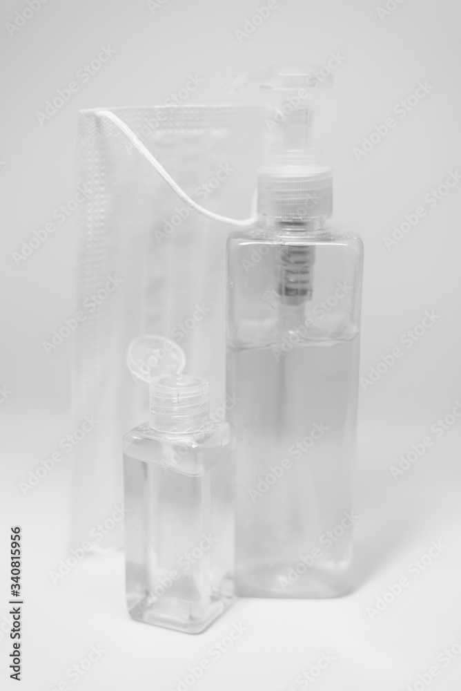 Hygienic face mask and Alcohol gel Sanitizer hand gel cleaners for anti Bacteria and virus on White Background, People using alcohol gel to wash hands to prevent COVID-19 virus