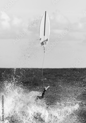 Sticker Black and white picture of a surfer at Tamarama beach