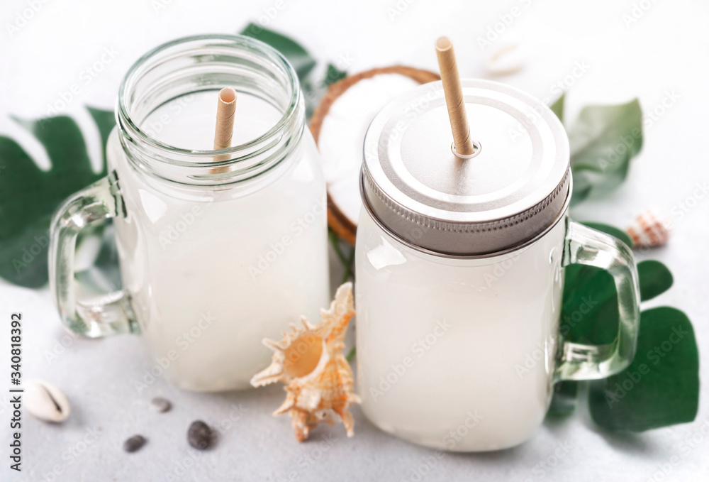 Coconut water drink in glass jar with handle Coconut water drink in glass jar with handle