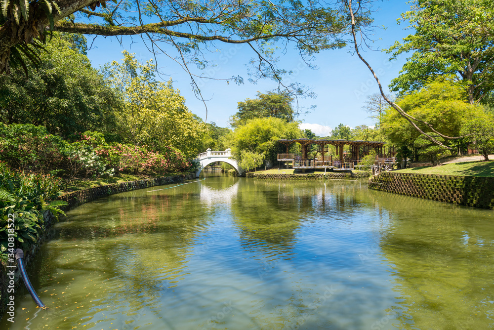 Watercourse around the island with the Bamboo Playhouse at Perdana Botanical Gardens, Kuala Lumpur