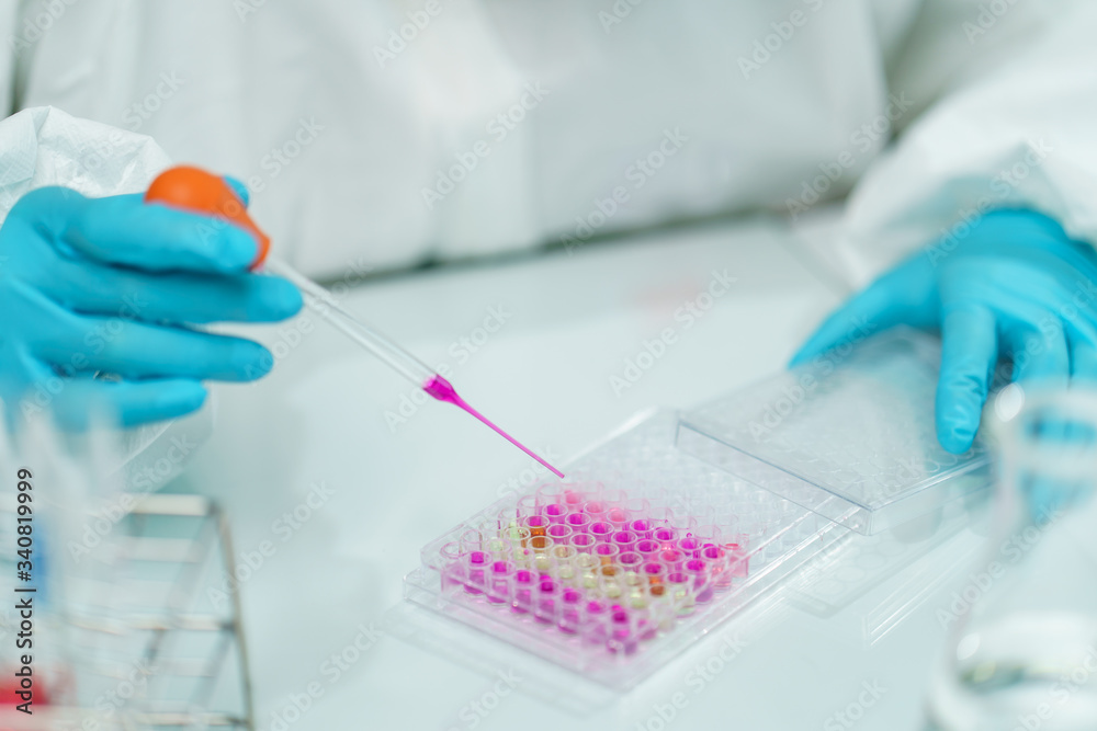 Scientist in laboratory with biological tube for analysis and sampling of Covid-19. Scientist in laboratory with biological tube for analysis and sampling of Covid-19.