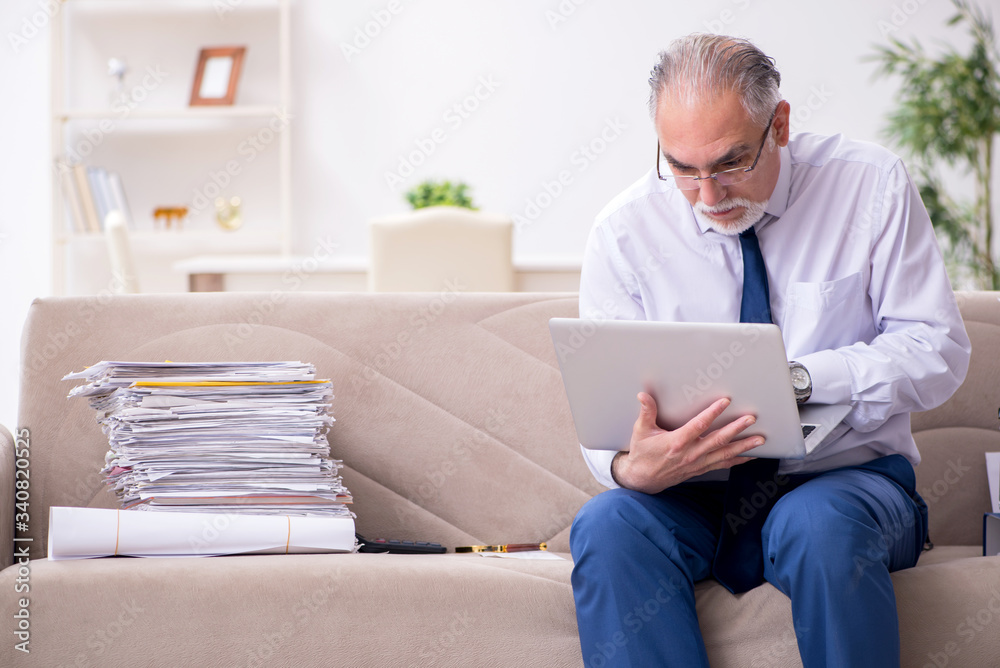 Aged businessman employee working from house Aged businessman employee working from house
