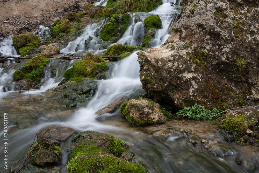City Cesis, Latvia. Old waterfall with green moss and dolomite rocks. City Cesis, Latvia. Old waterfall with green moss and dolomite rocks.
