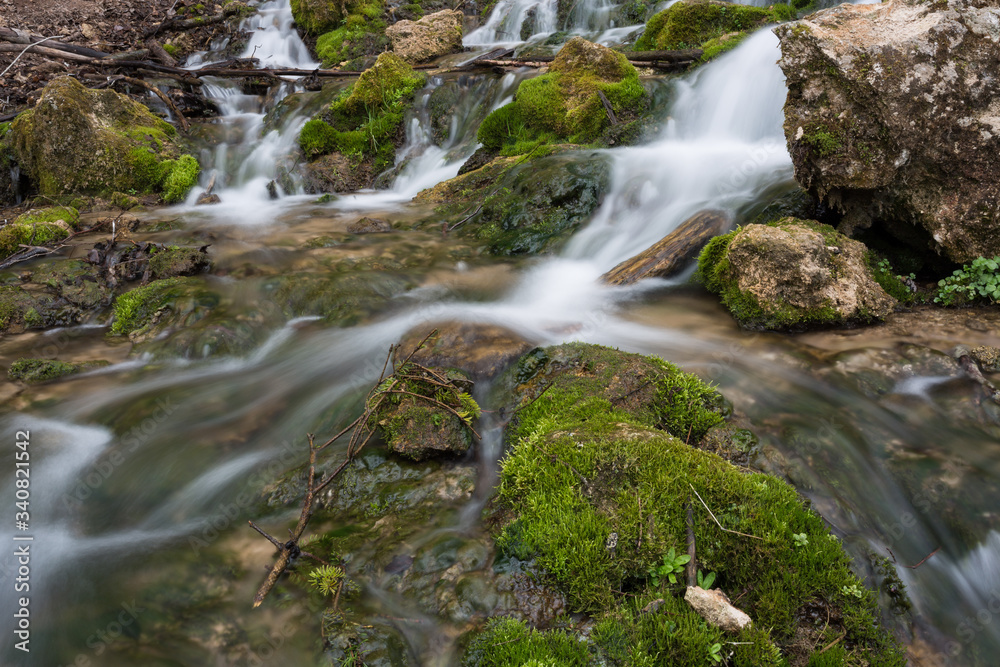 City Cesis, Latvia. Old waterfall with green moss and dolomite rocks. City Cesis, Latvia. Old waterfall with green moss and dolomite rocks.