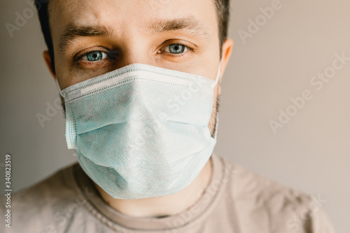 Close-up of a man in a medical mask. Self isolation.