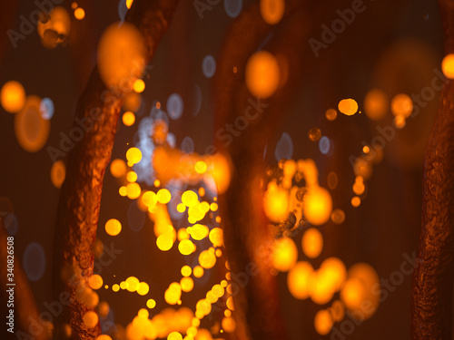 Yellow glowing particles, bacteria, viruses in a dark red foggy room.