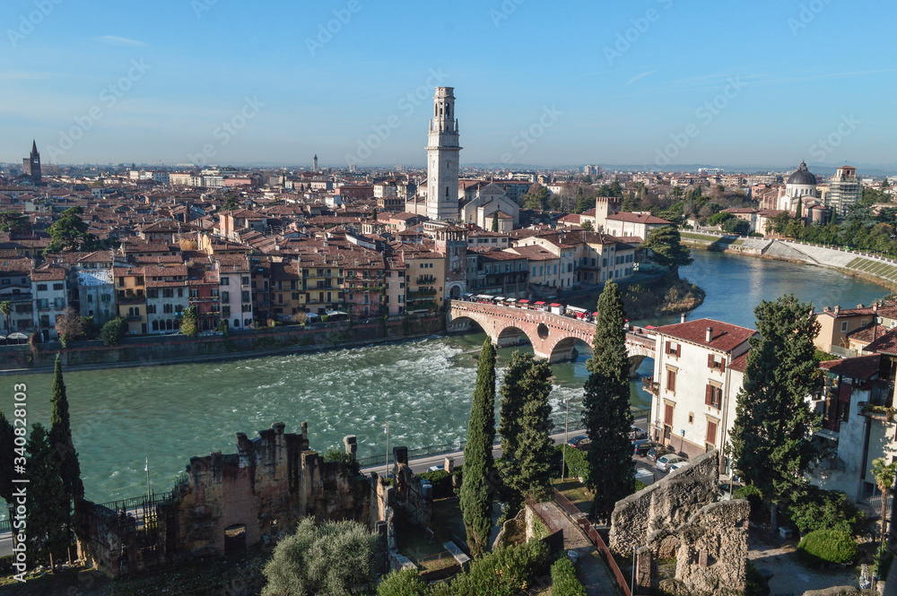 Beautiful top view of the Adige river with bridges and the city of Verona.
