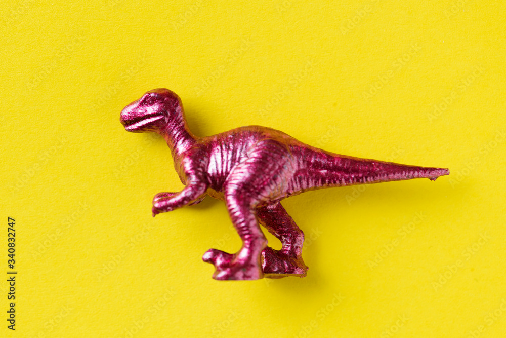 Naklejka premium Aerial view of dinosaur toy with colorful background