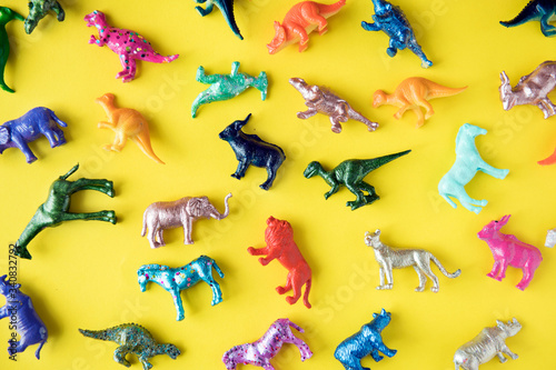 Fototapeta Naklejka Na Ścianę i Meble -  Various animal toy figures in a colorful background