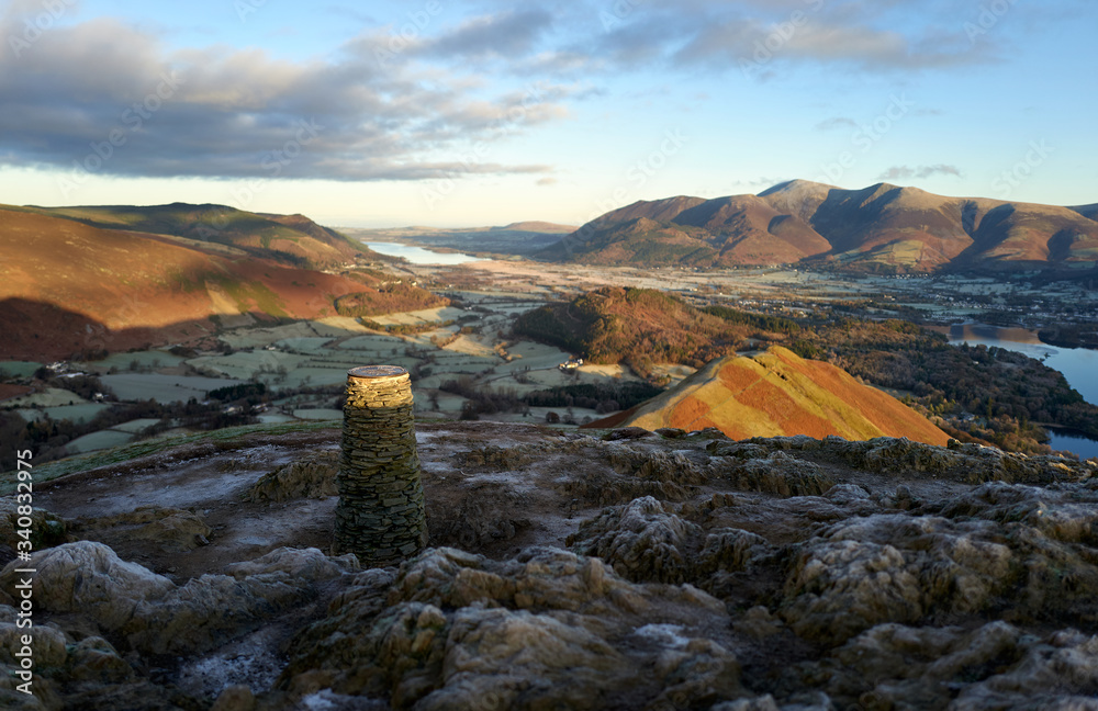 Sunrise over Braithwaite and Derwent Water near Keswick with the summits of Skiddaw in the distance from Cat Bells on a cold winters morning in the Lake District.