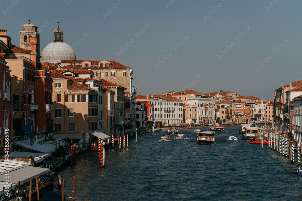 View of the city and the Grand Canal in Venice the Grand Canal on which there are many large and small boats with ferries | VENICE, ITALY - 16 SEPTEMBER 2018. 