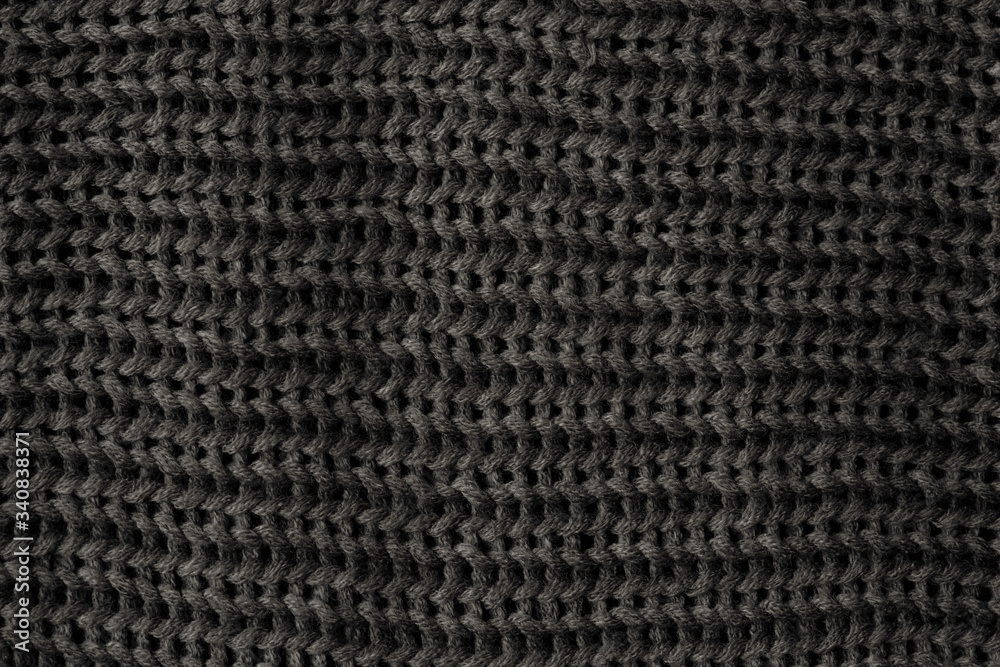 Black knitted fabric background Black knitted fabric background