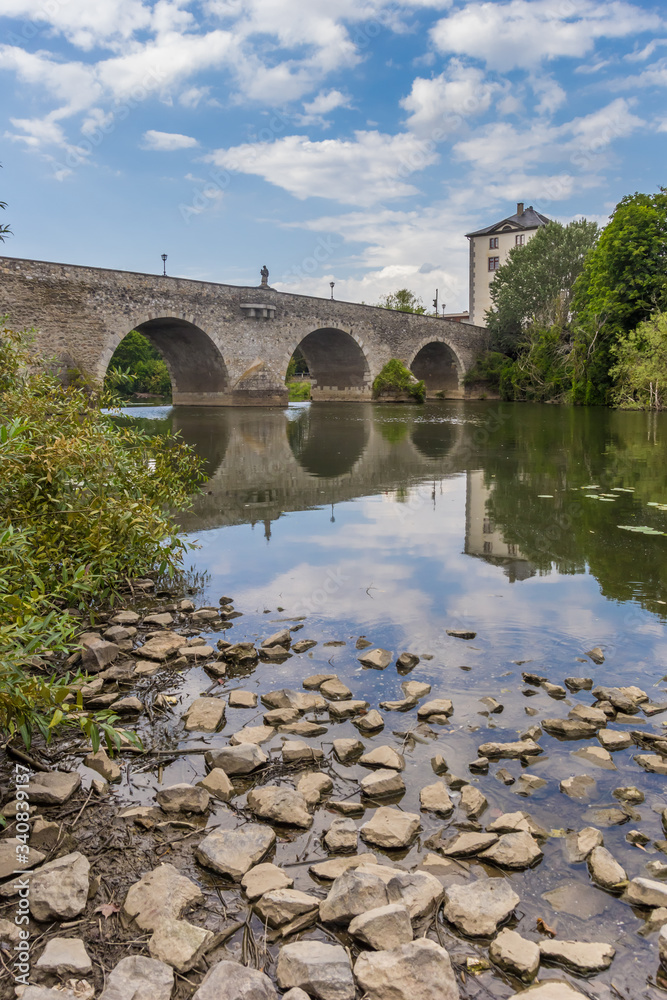 Old stone bridge over the Lahn river in Limburg, Germany