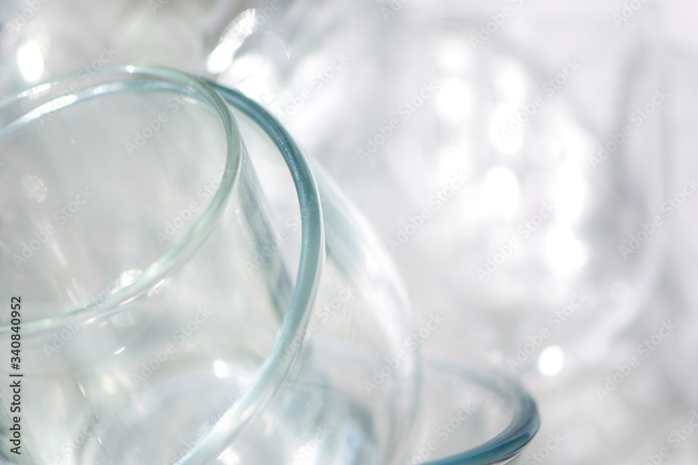 a set of glassware on the windowsill and reflection in bright sunlight a set of glassware on the windowsill and reflection in bright sunlight