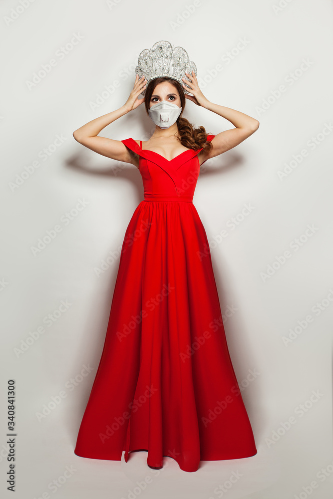 Fashion portrait of glamorous woman in medical face mask and diamond crown Fashion portrait of glamorous woman in medical face mask and diamond crown