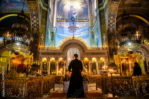 Interior of the St. Volodymyr's Cathedral with altar and fragments of frescoes wall paintings. Kyiv, Ukraine. April 2020 photo