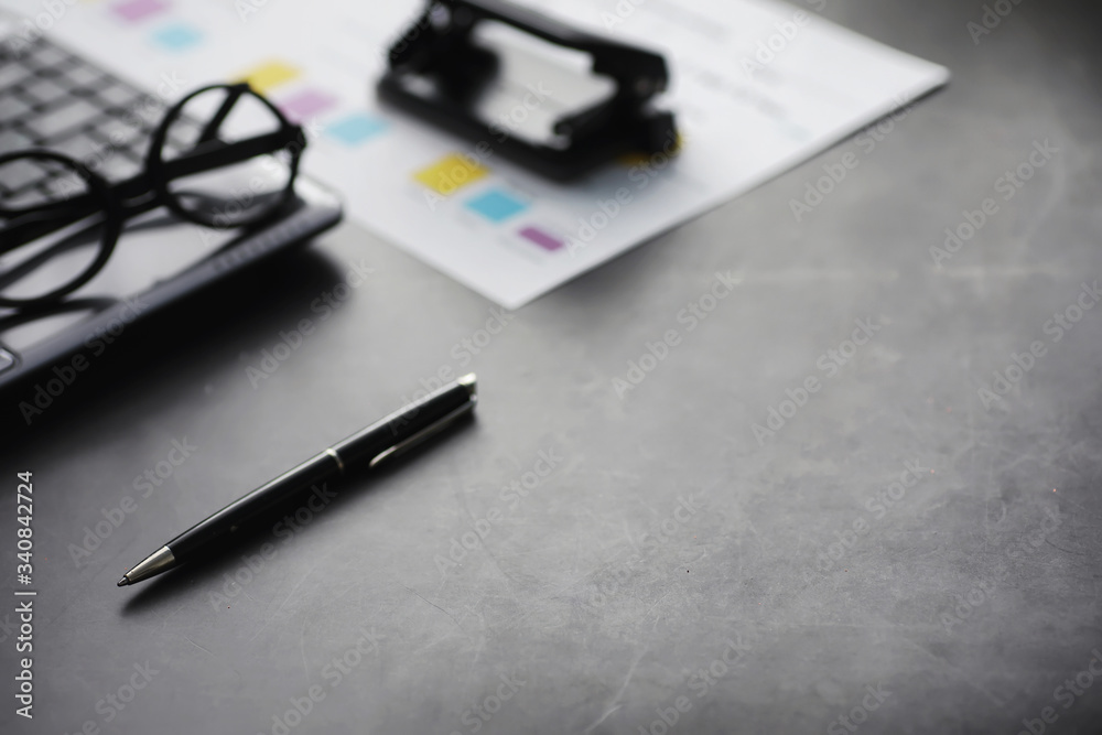 Working time symbolizes the desktop. Office desk with papers from an insurance manager and banker. Office worker at the table. The concept of lack of time. Working time symbolizes the desktop. Office desk with papers from an insurance manager and banker. Office worker at the table. The concept of lack of time.