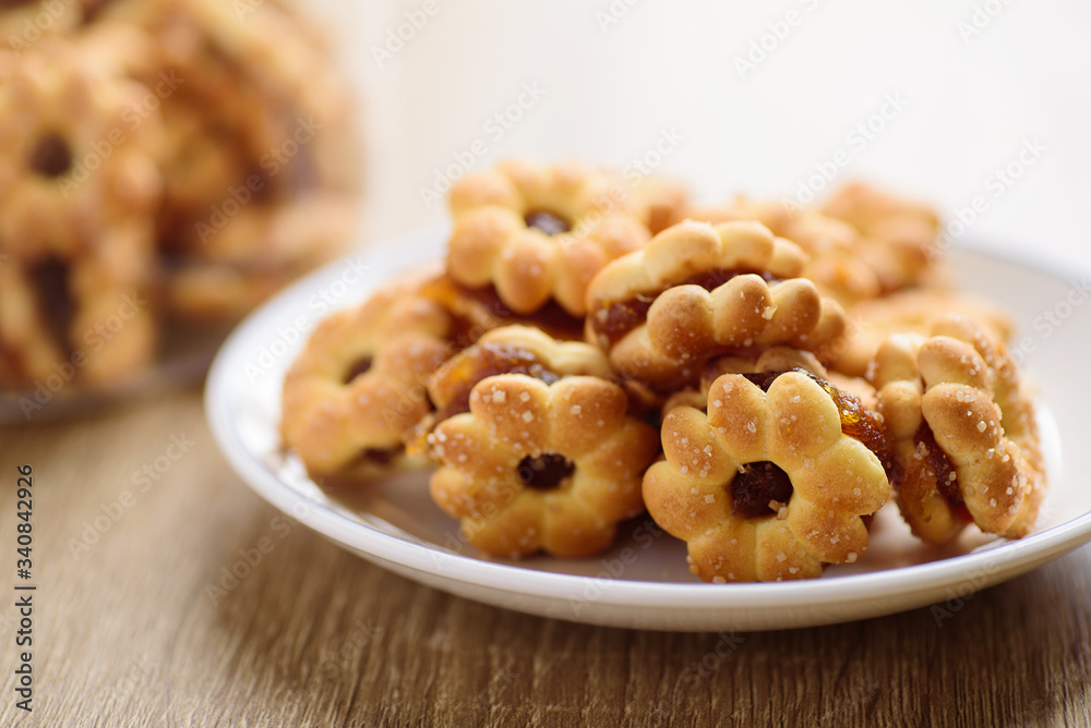 Cracker with pineapple jam (flower shape) on plate ready to eating, Thai snack Cracker with pineapple jam (flower shape) on plate ready to eating, Thai snack