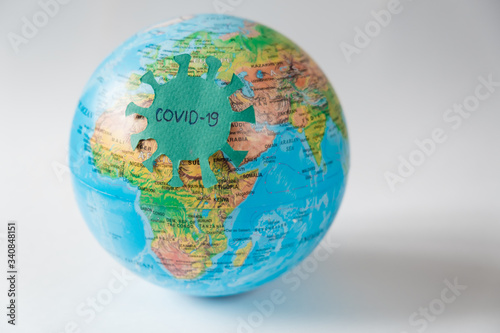  Pandemic Covid-19. Globe with the coronavarus virus on a white background. The concept of a global epidemic.