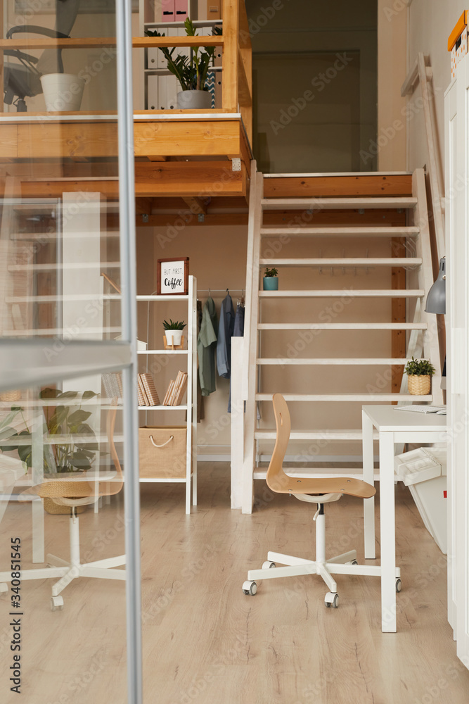 Vertical background image of home office desk in modern minimal design with wooden decor, copy space