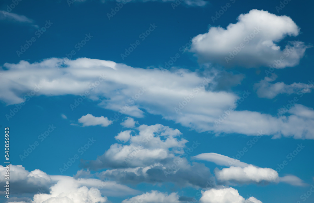 Texture of clouds against a blue sky, dramatic background of a cloudy sky, background with a rich blue color, changes in the atmosphere movement of cyclones and air masses Texture of clouds against a blue sky, dramatic background of a cloudy sky, background with a rich blue color, changes in the atmosphere movement of cyclones and air masses