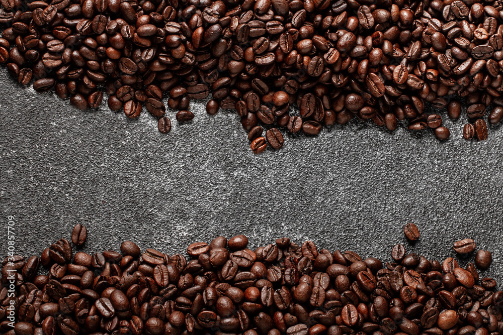 Coffee beans on dark concrete background with copy space. Top view. Coffee beans on dark concrete background with copy space. Top view.
