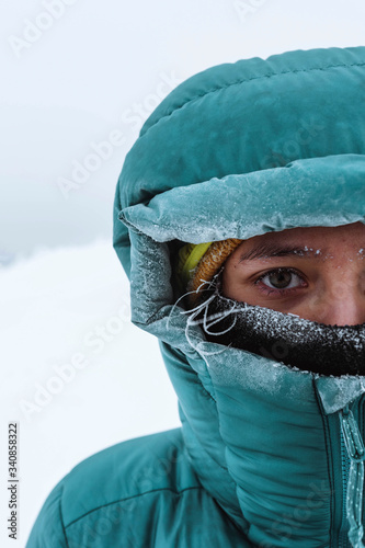 Closeup of a female mountaineer in wintertime at Glen Coe, Scotland