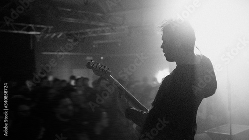 Guitarist playing electric guitar in a rock concert © rawpixel.com