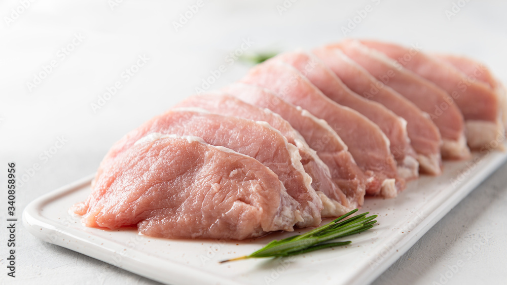 Fresh meat with spieces for cooking on white background, side view, close up. Cooking, raw ingredients Fresh meat with spieces for cooking on white background, side view, close up. Cooking, raw ingredients