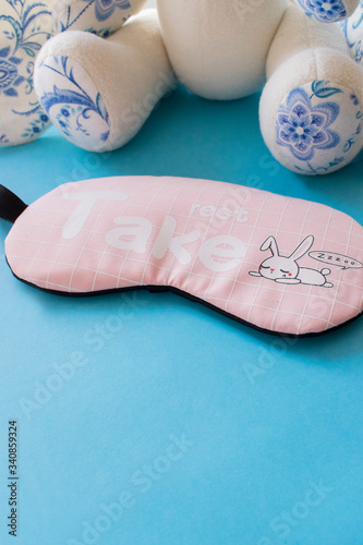 sleep mask on a blue background
