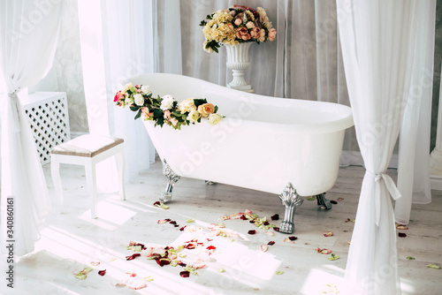 White bath with rose petals