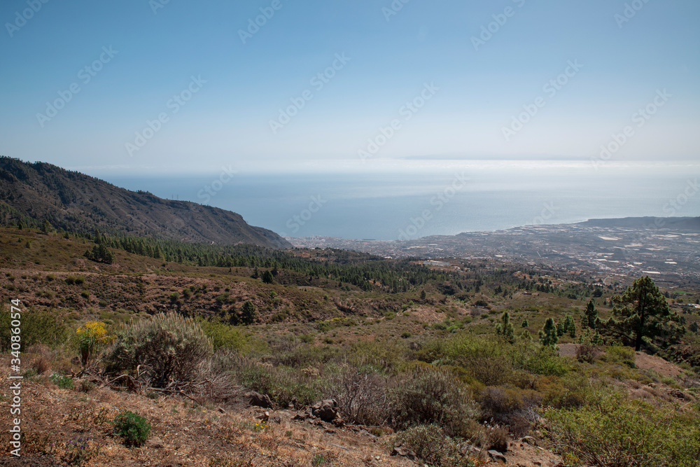 View of the green slopes of Guimar valley, situated on the east coast of the island, as seen from a viewpoint known as Mirador de Chivisaya, on Carretera Los Loros, in Tenerife, Canary Islands, Spain
