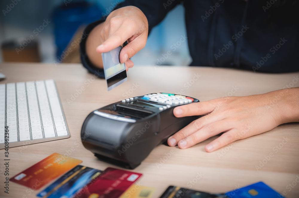 Fototapeta premium business paying with credit card machine, client purchase payment concept