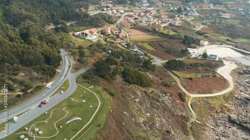 Paragliding in the coast of Lugo. Galicia Spain. Drone View photo