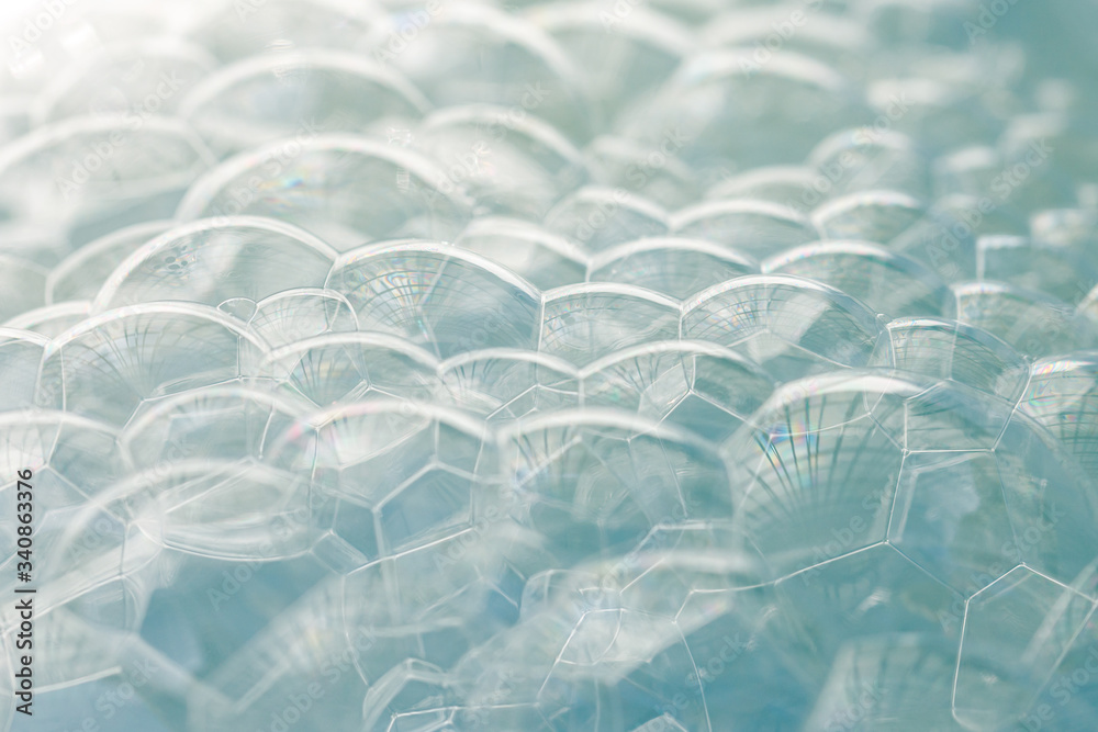Obraz premium Pile of light blue soap bubbles with a gradient from white to light blue, use as background or tutorial to wash your hands 