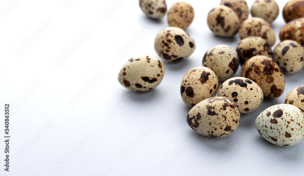Fresh quail eggs isolated on white background with copy space