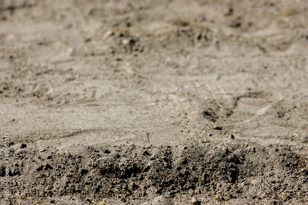 Sand dirt gravel closeup shot with copy space for background, footprint 