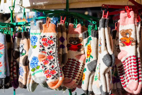 Traditional knitted socks as rural souvenirs on street market © rostovdriver