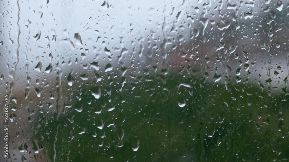 Raining on a window, rain drops on the window Raining on a window, rain drops on the window