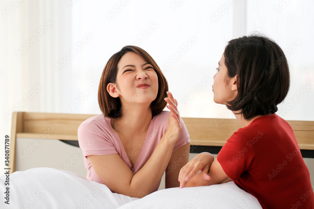 Happy Couple  asia woman  bored with bad breath in bedroom morning.