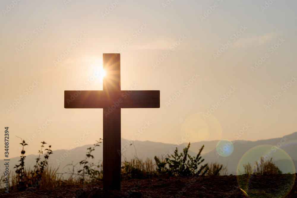 Silhouette cross on mountain at sunset background.Crucifixion Of Jesus Christ Silhouette cross on mountain at sunset background.Crucifixion Of Jesus Christ