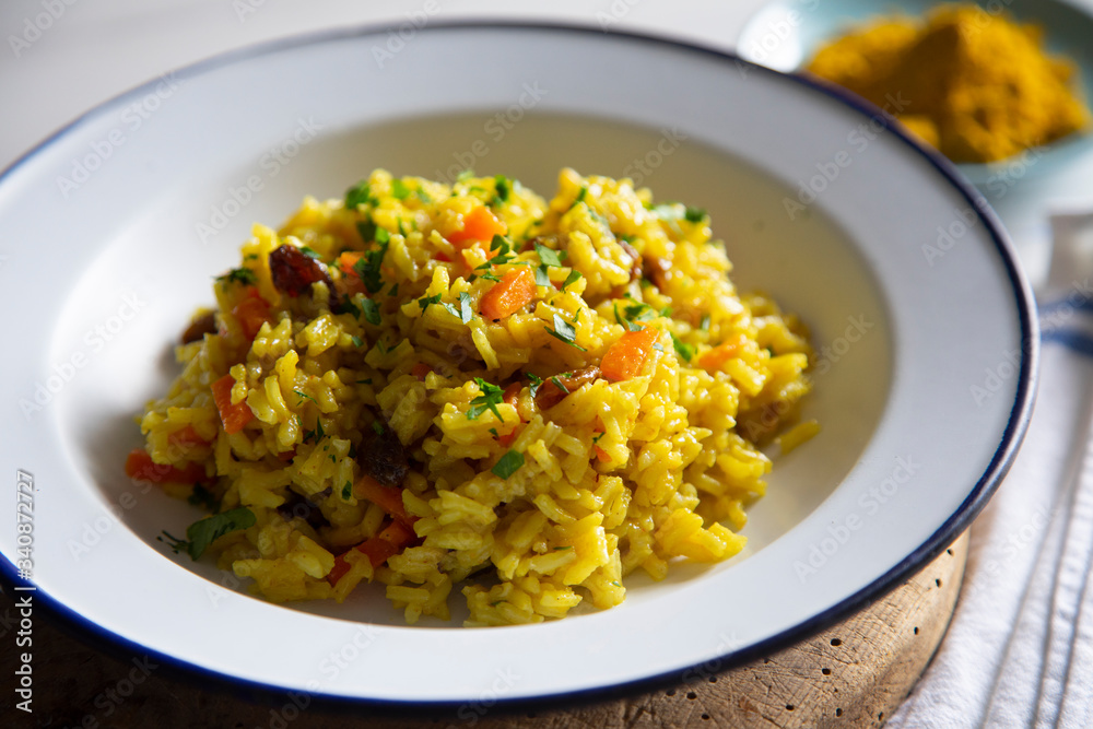 Yellow curry rice with vegetables and raisins