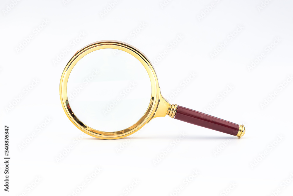 Maroon handle and golden rim Magnifying glass on a white background Maroon handle and golden rim Magnifying glass on a white background