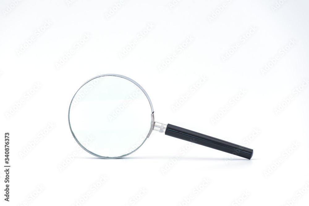 Black handle and metal rim Magnifying glass on a white background Black handle and metal rim Magnifying glass on a white background